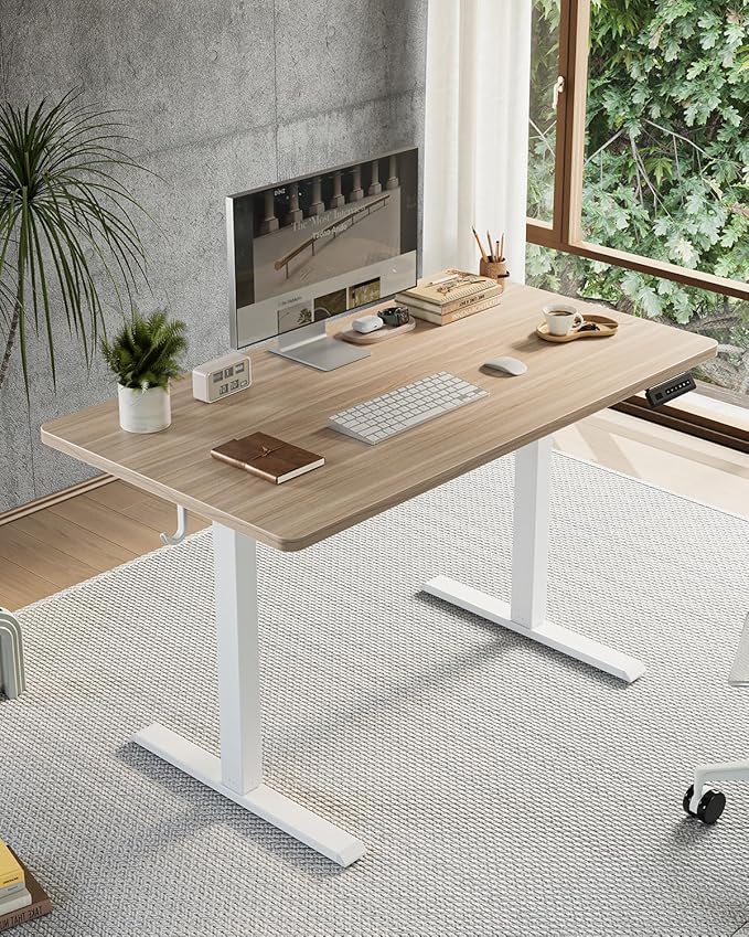 FEZIBO One-Piece Standing Desk Adjustable Height Stand up Home Office Desk, 55x24 Inch Electric Standing Computer Desk, with 4 Memory Presets, Fixable casters, Light Walnut