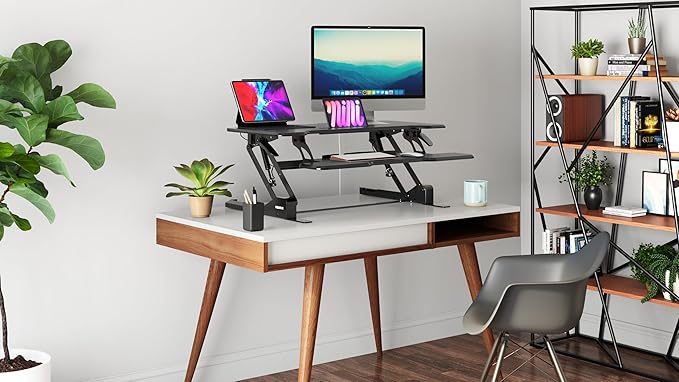 Mount-It! Height Adjustable Standing Desk Converter, 38” Wide, Stand Up Desk Riser for 2 Monitors, Manual Gas Spring Desktop Raises to 16.9", Fits Two Monitor Screens with Keyboard Mouse Tray in Black